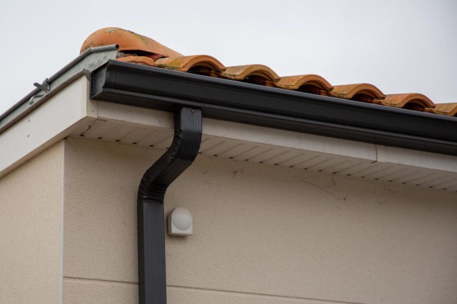 Gutters and Downspouts: The Drainage System